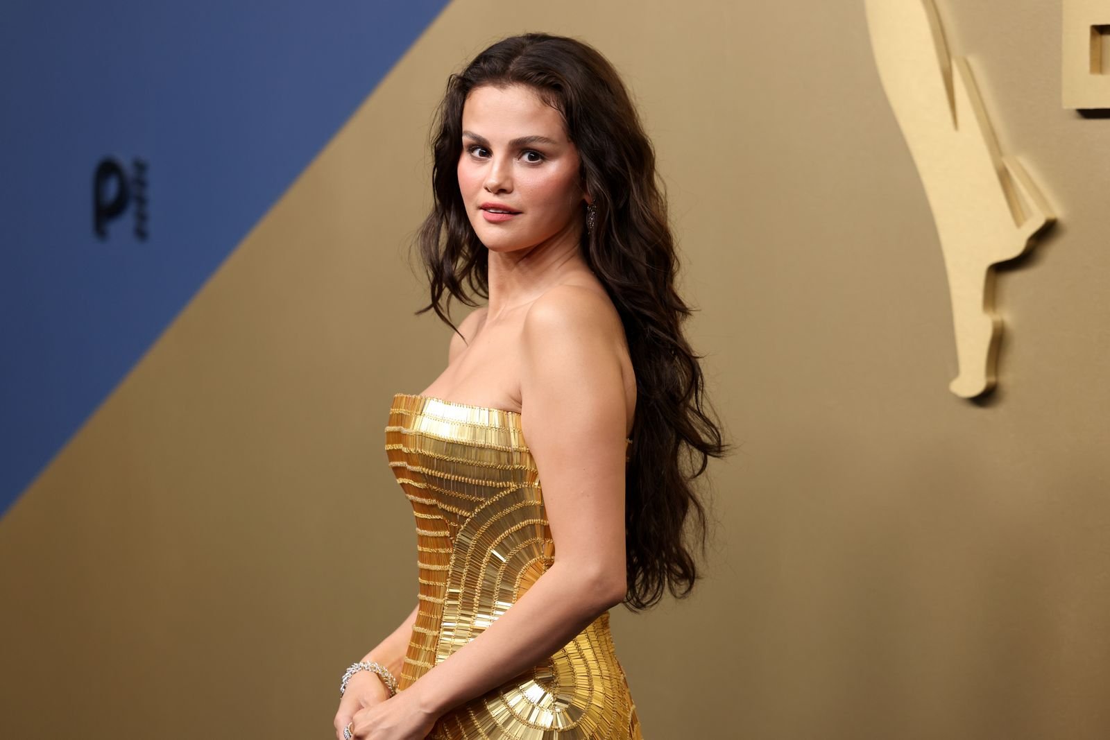 Selena Gomez in her gold Louis Vuitton gown